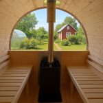 Panoramic glass rear wall for barrel sauna